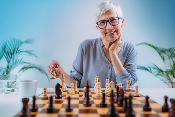 Cognitive Rehabilitation Activity. Senior Woman Playing Chess.