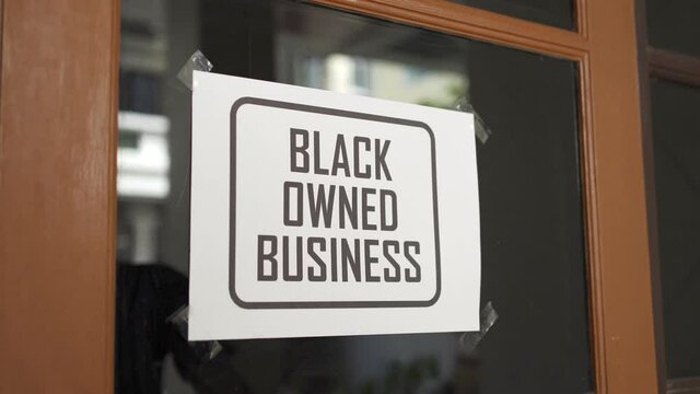 Black owned business sign were attached on the window