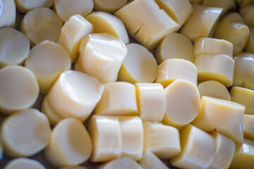 Close-up of silky egg tofu showing smooth texture and soft, delicate surface. The image highlights...