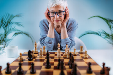 Senior Woman Playing Chess. Cognitive Rehabilitation Therapy.