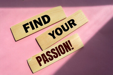 Find your passion! words on wooden blocks on pink background. 