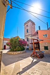 Mediterranean stone village on Krapanj island square and tower view, sea sponge harvesting village