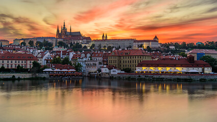 The famous Prague castle during a beautiful orange dusk.