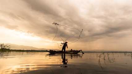 Fisherman of Bangpra Lake in action when fishing, Thailand