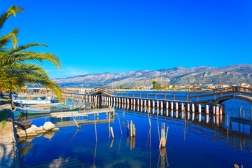 Greece, Beautifull reflections of wooden fishing boats on water on sea lake in Aitoliko in Central Greece