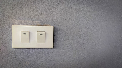 light switch on wall isolated on grey background