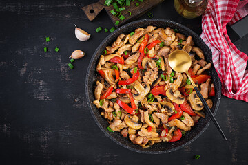 Stir fry with chicken, mushrooms and sweet peppers - Chinese food. Top view, above