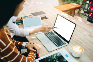 Business, woman teamwork meeting point to discuss the graph up and down of the economy and work on a laptop mockup for use working on the morning.