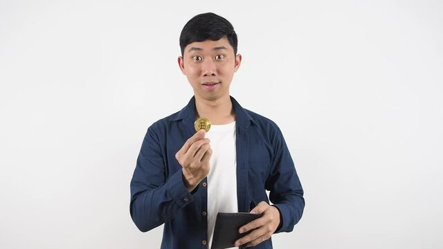 Asian man feeling shocked found bitcoin in his wallet white background digital monney concept