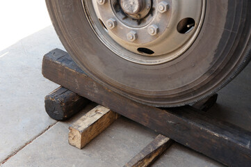 Wheel and Tire of Truck on the timber wood