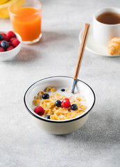 Cornflakes with berries and milk. Dry breakfast.