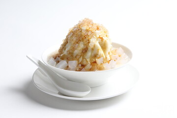chilled soya pudding jelly with sea coconut sago ice snow kacang and brown sugar syrup in white bowl sweet dessert menu