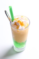 ice milk drink with mango durian fruit and coconut pandan jelly pudding in tall glass and beverage menu