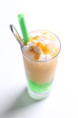 ice milk drink with mango durian fruit and coconut pandan jelly pudding in tall glass and beverage menu