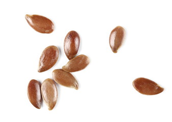 Brown flax seeds, linseed pile macro isolated on white background, top view