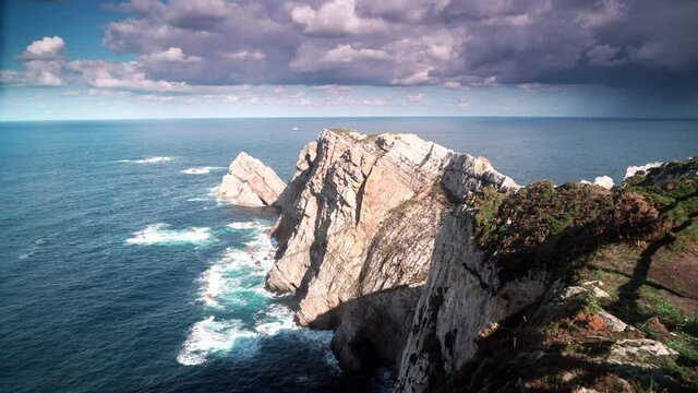 Seascape of Atlantic ocean and Asturias rocky coast at Cape Penas. Sea shore with high cliffs in north Spain.