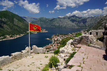 Bay of Kotor with flag of Montenegro - obrazy, fototapety, plakaty