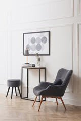 Hallway with stylish console table and armchair. Interior design