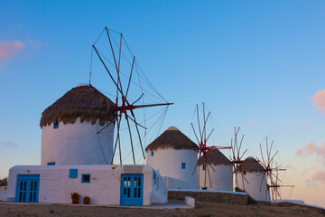 Windmills in a row at dawn Mykonos island cyclades Greece