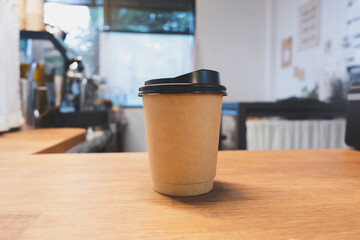 Image of a coffee cup in a cafe's counter area