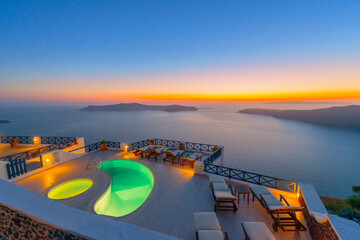 Greece famous santorini island in Cyclades, panoramic sea view of caldera at summer in front of swimming pools © korpithas