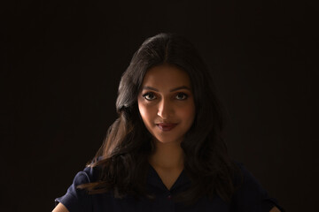 Portrait of a beautiful woman on a dark background