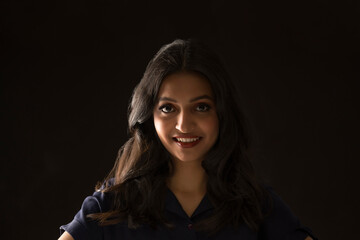 Portrait of a beautiful woman on a dark background