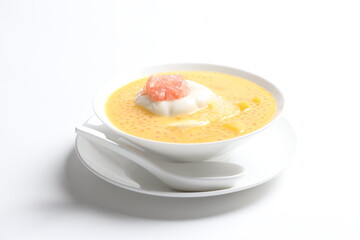 chilled mango sago fruit with pomelo and soya pudding jelly in white bowl sweet dessert menu