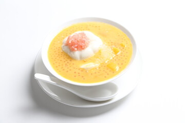 chilled mango sago fruit with pomelo and soya pudding jelly in white bowl sweet dessert menu