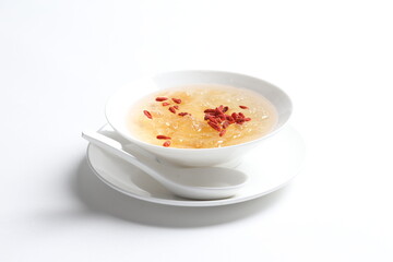 chilled double boiled fresh bird nest with hashima and wolf berries asian sweet soup in white bowl healthy dessert halal vegan food menu for Hong Kong cafe