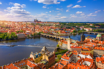 Obraz premium Prague scenic spring aerial view of the Prague Old Town pier architecture Charles Bridge over Vltava river in Prague, Czechia. Old Town of Prague with the Castle in the background, Czech Republic.