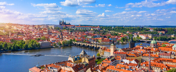 Naklejka na ściany i meble Prague scenic spring aerial view of the Prague Old Town pier architecture Charles Bridge over Vltava river in Prague, Czechia. Old Town of Prague with the Castle in the background, Czech Republic.