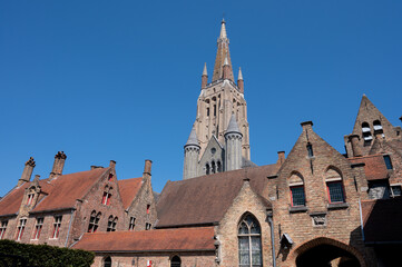 Obraz premium 27 April 2021, Bruges, Belgium, walking on medieval Bruges streets in sunny day, travel destination
