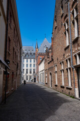 Fototapeta na wymiar 27 April 2021, Bruges, Belgium, walking on medieval Bruges streets in sunny day, travel destination