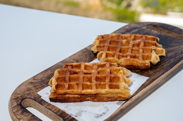 Belgian sugar waffles served on outdoor cafe terrace