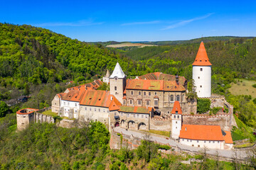 Obraz premium Aerial view of castle Krivoklat in Czech republic, Europe. Famous Czech medieval castle of Krivoklat, central Czech Republic. Krivoklat castle, medieval royal castle in Central Bohemia, Czechia.