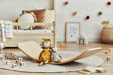 Creative composition of cozy scandinavian child's room interior with mock up poster frame, balance...