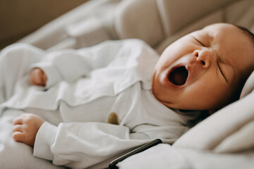 Closeup of a newborn baby yawning.