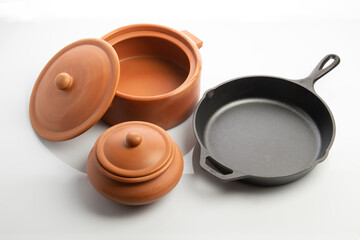 Cast Iron Skillet and Clay Pots Isolated on White Background