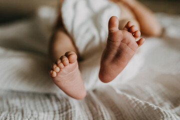 Closeup of newborn baby feet.