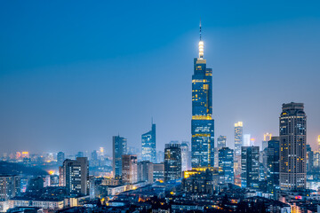 Fototapeta na wymiar Night view of Zifeng Building and city skyline in Nanjing, Jiangsu, China