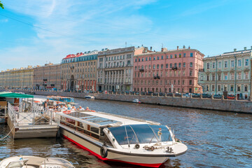 Fototapeta na wymiar Panorama of the city of St. Petersburg in summer. Tourist boat tours on the river. Saint Petersburg, Russia - 05 June 2021 
