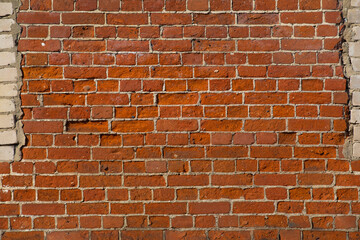 old texture wall made of colored and white bricks, background, grunge