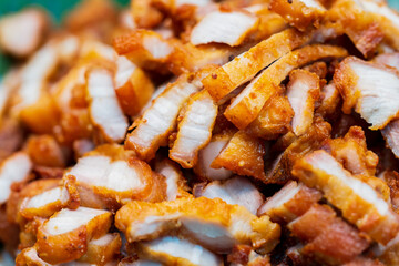 Close up of Fried Pork Belly with Fish Sauce, thai street food market