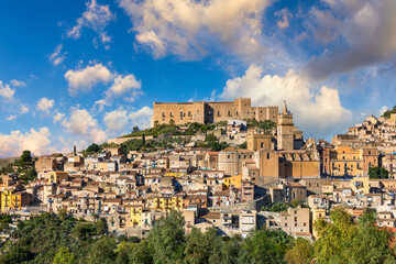 Fototapeta na wymiar Caccamo, Sicily. Medieval Italian city with the Norman Castle in Sicily mountains, Italy. View of Caccamo town on the hill with mountains in the background, Sicily, Italy.