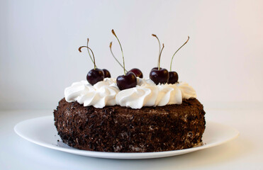 Homemade cherry cake with vanilla and decorated with black cherries.
