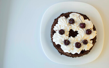 Homemade cherry cake with vanilla and decorated with black cherries.