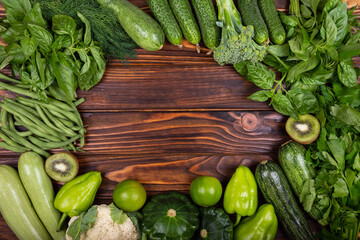 Green vegetables on wooden table. Protein source for vegetarians.Composition with healthy vegetarian meal ingredients. Raw food concept. A variety of organic fruits and vegetables. Vegan menu.