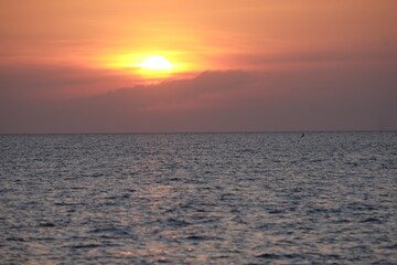 Beautiful sunset in early evening time with the dark sea.