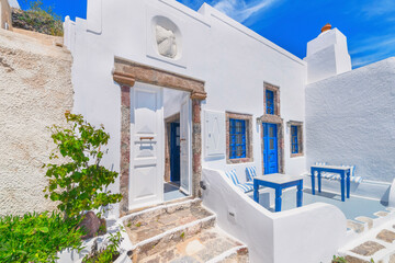 Greece Santorini island in Cyclades, traditional view of white washed houses with colorful wooden frames